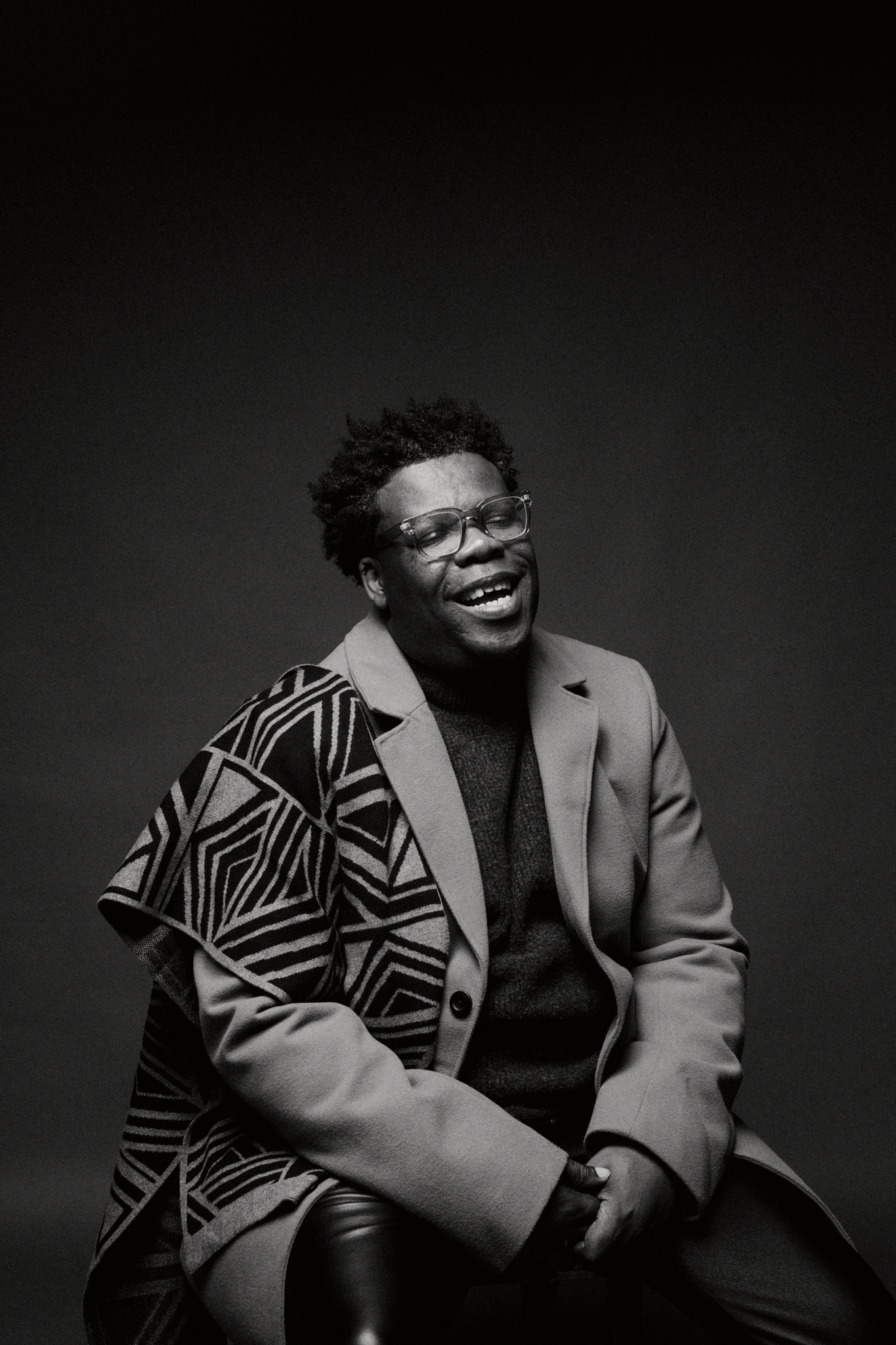 black and white photo of avery r young laughing
