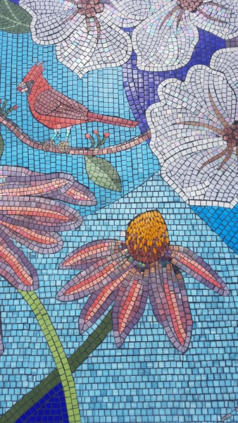  Detail of Lutz mosaic, blue background tile with purple and pink flower made of tile. 