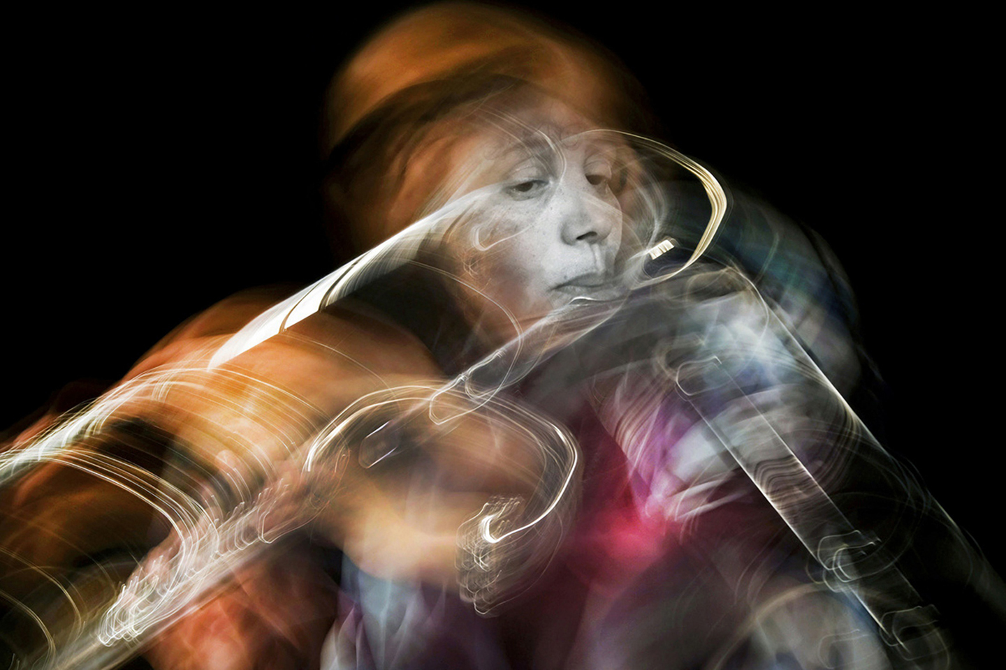 A woman playing a flute sits at the center, with swirls of incandescence emanating from her flute