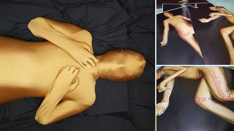  triptych: person wearing a golden bodysuit laying on a black sheet. Photos of photos of person in bodysuit in different positions. There are red X marks on the body 