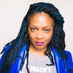 Black woman with blue tinged locs