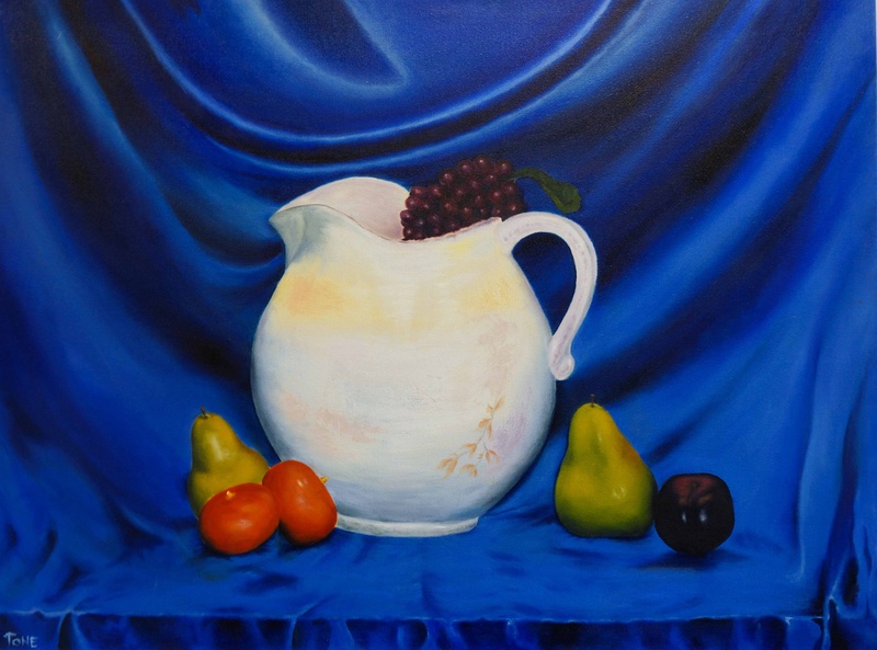  Still life painting of an upright white jug with grapes balancing on the rim, sitting on a blue-draped table with pears and other fruit around the jug's base 