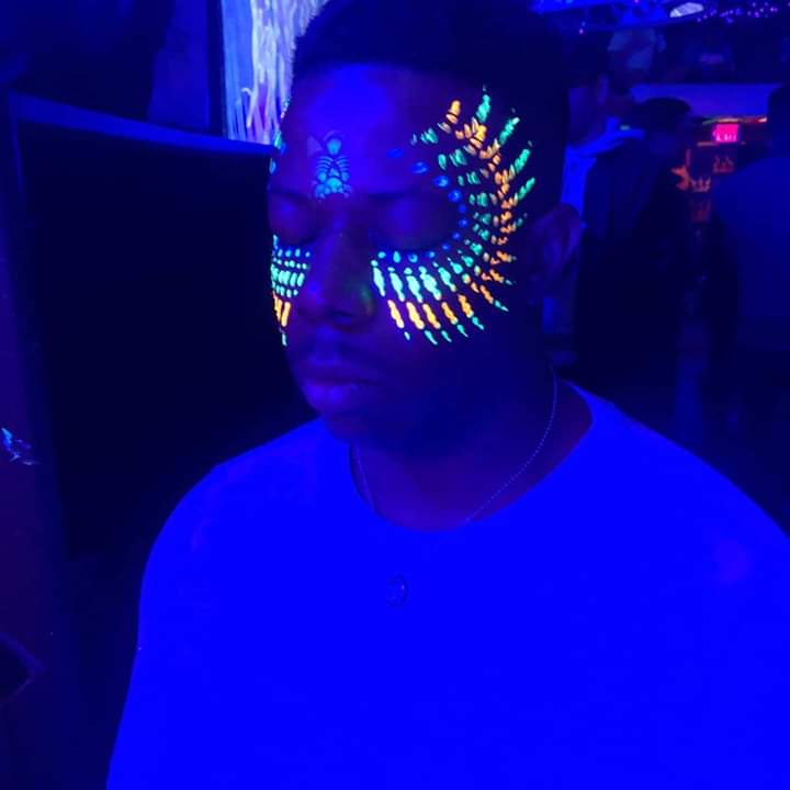 Willyum in blacklight with face paint